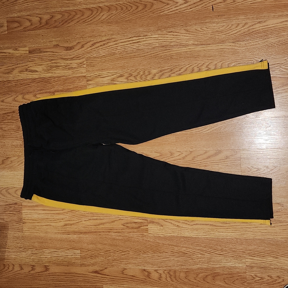 H&M pre owned black/gold track pants size Medium